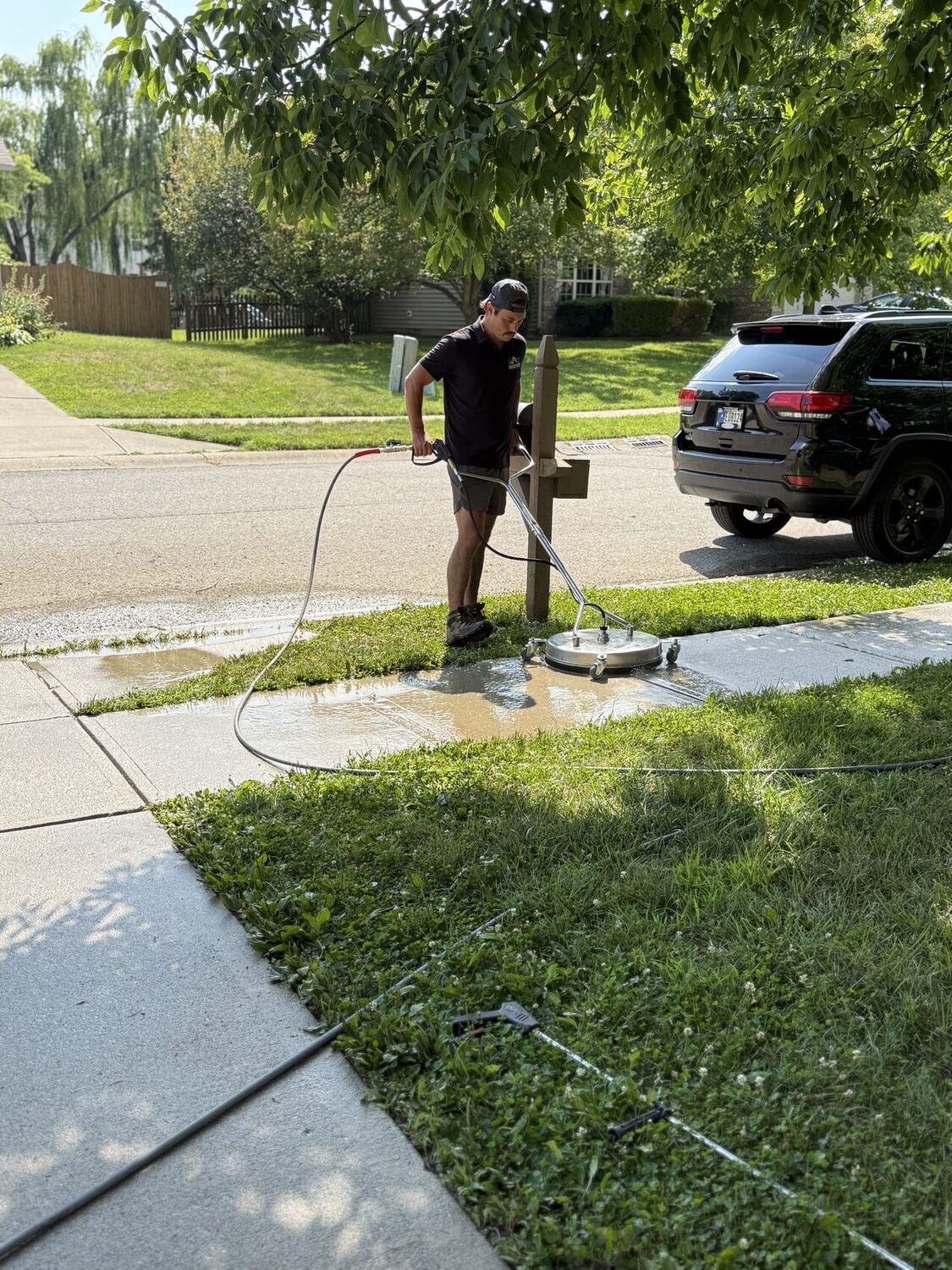 Anderson Exterior Cleaning surface cleaning a sidewalk in Indianapolis, IN