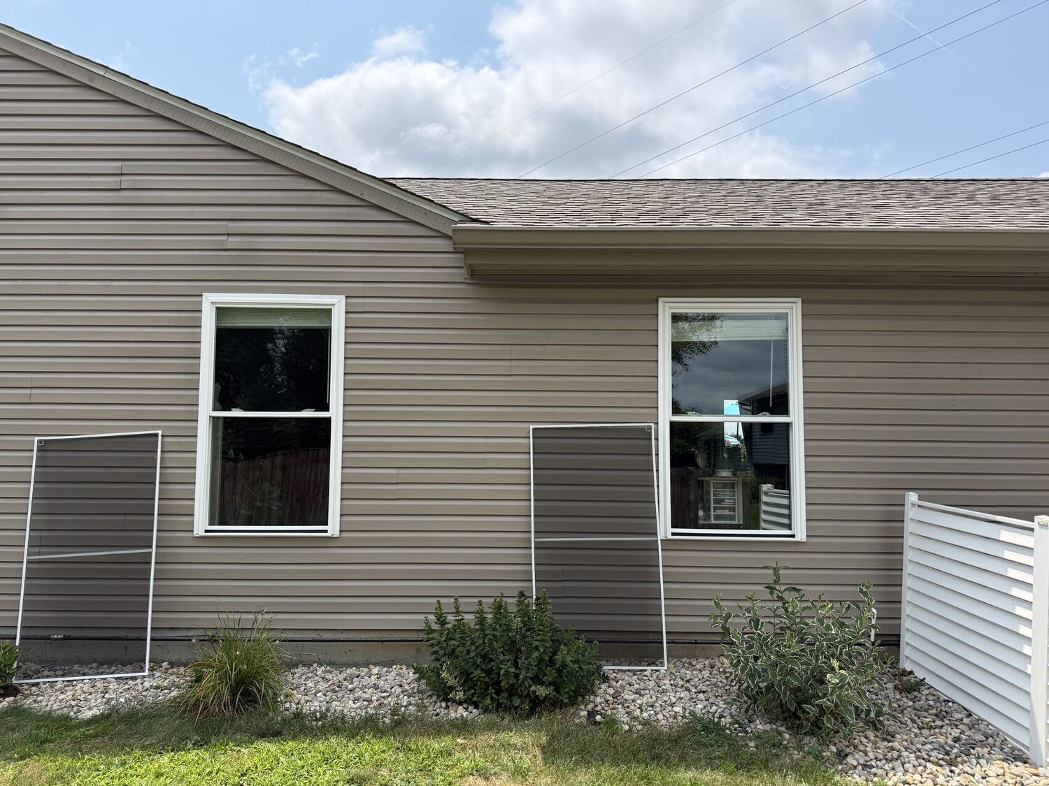 Exterior window and screen cleaning on an Indianapolis-area home