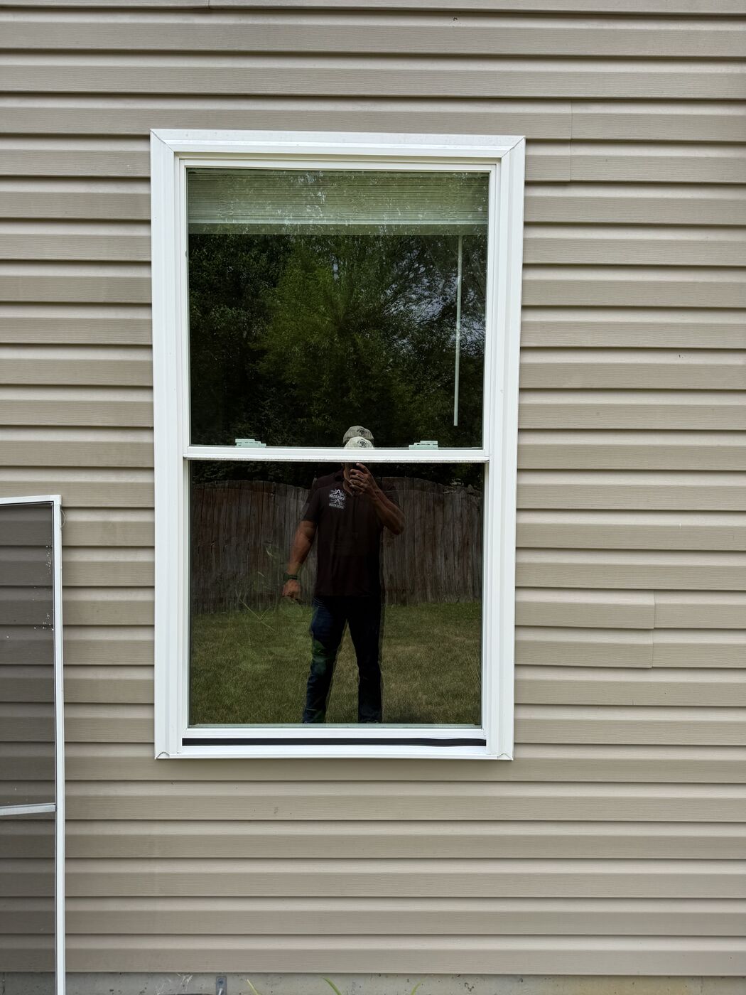 Window cleaning in progress on an Indianapolis-area home