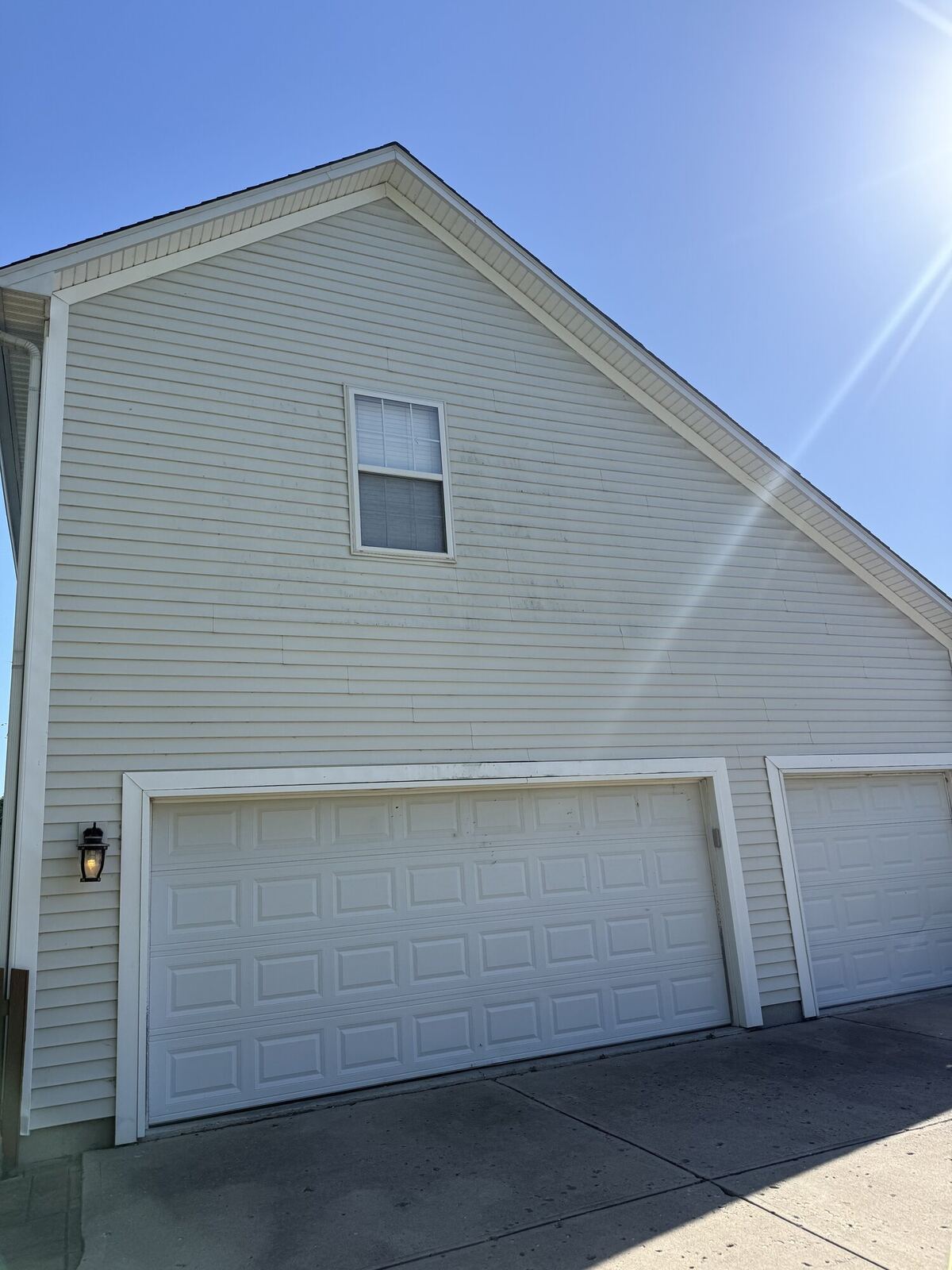 Same home siding after house washing, clean