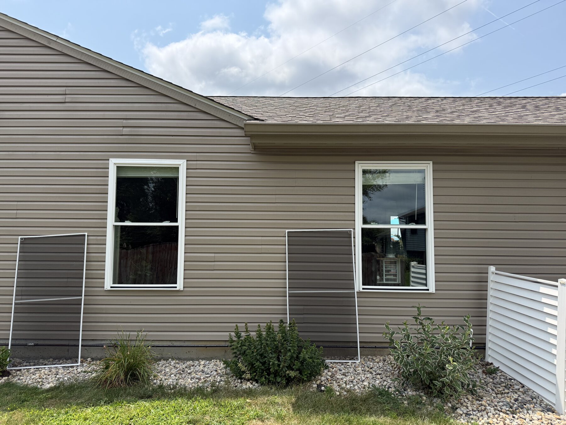 Freshly cleaned windows on an Indianapolis-area home, screens removed for detailing